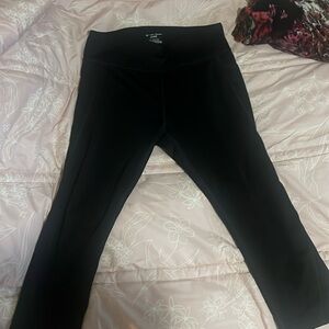 Black workout mid leg leggings with pockets and sheer on the side